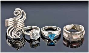 Collection Of Four Silver Stone Set Rings.