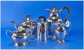 Silver Plated 4 Piece Tea Service with raised stylized floral decoration. Marked Elkington and Co.