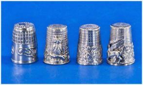 Four Unusual Silver Thimbles. One Featuring a Perched Owl. The Others an Antelope, a Dragon and a