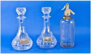 Pair of Decanters, of pressed glass, with a Schweppes Soda Water dispenser, (3).