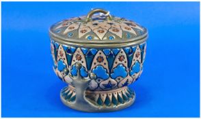 Amphora Circular Footed Cover Box, the deep, curved, inner rim design of the lid suggesting a