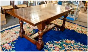 Jacobean Style Oak Dining Table, the plank top with cleated ends, raised on four heavy turned legs