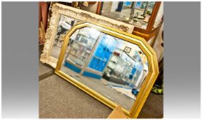 Two Mirrors. One in an octagonal gilt frame with etching, 37 inches by 30 inches in size. The other