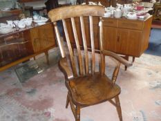 20th Century Elm and Beech Windsor Armchair, with slatted back, elm seat and arm rests, raised on