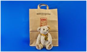 Steiff Teddy Bear, in a white covering of wool and cotton, with moving arms, head and limbs,