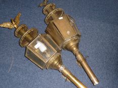 Pair Of Large Brass Georgian Style Coach Lamps with the typical faceted glass sides, surmounted by