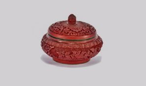 A Small Round Chinese Lidded Cinnabar Lacquered Cosmetic Box Of Traditional Form, well carved with