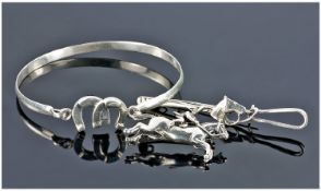 Equestrian Interest, Comprising Two Silver Brooches and a Silver Bangle.