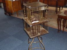 Early 20th Century Two-Tier Revolving Bookcase, with a brass frame supporting wooden surfaces,