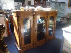 Mid Victorian Walnut Veneered Credenza, the projecting sections fitted with applied ormolu mounts