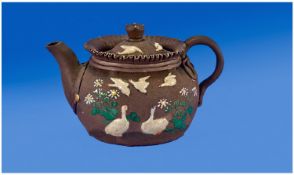 Japanese Bisque Porcelain Teapot, with white bird decoration amongst flowering foliage on a medium