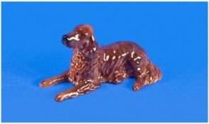 Beswick Model Of A Reclining Retreiver Dog In Brown Glaze. 6`` in height.