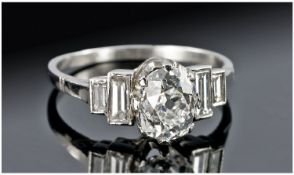 18ct White Gold Diamond Ring Set With A Central Old Oval Cut Between Four Baguette Cut Diamonds,