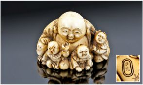 Japanese 19th Century Good Quality Ivory `Netsuke` Of Hotei, with three small children. Fully