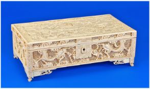 Extremely Fine Quality Canton Carved Ivory Lidded Box Of Oblong Form on carved bracket type feet.