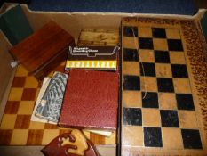 Box Containing a Collection of Chess Items, including a box of carved chess pieces in ebony and