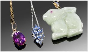 Three 9ct Gold Mounted Pendants, Set With Iolite, Jadeite Stone Carved Rabbit And A Bright Pink/