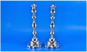 Victorian Pair Of Fine Silver Table Candlesticks, with chased and incised decoration, raised on