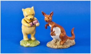 Royal Doulton Winnie The Pooh Collection. 1, Winnie and the present. 2, Kanga. Both in original