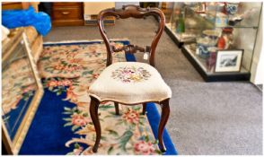 Early Victorian Rosewood Parlour Chair, of balloon-back form, having a scroll carved crest rail and