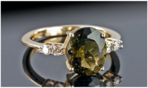 9ct Gold Diamond Dress Ring, Set With a Central Green Stone Between Four Round Cut Diamonds.