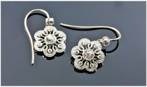 Antique Very Fine Pair Of Platinum Set Diamond Earrings with pierced openwork decoration. The