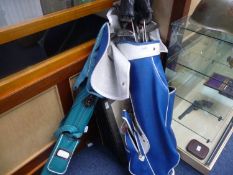 Two Golf Bags Containing A Collection Of Mostly `Ping` Clubs and Irons.