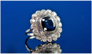 Platinum Diamond & Sapphire Ring, Central Cushion Shaped Sapphire Surrounded By Round Modern