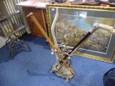 Figural Brass Stick Stand, in the Rococo style, raised on a scrolling base, containing 4 sticks, 23