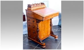 Mid Victorian Walnut Davenport, the top section fitted with a stationery compartment with fretwork