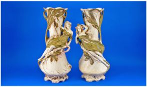 Large Pair of Royal Dux Art Nouveau Vases, each showing a semi-reclining naiad perched above a
