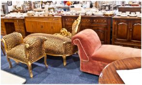 Rococo Style Giltwood Settee, upholstered with leopard print fabric, together with a matching