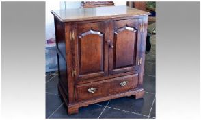 Solid Oak TV Cabinet, in the style of a George II cabinet, fitted with two panelled doors to front,