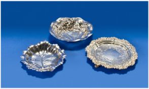 Three Silver Dishes, 1. An American Art Nouveau Dish. The interior boldly embossed with budded