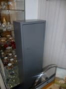Steel Framed Gun Cabinet, with two locks to door, 52 inches high, 16 wide and 9 deep.