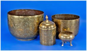Two Middle Eastern Engraved Brass Planters, with a lidded brass engraved jar and a footed bowl. c.