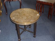 Oriental Brass Table, the circular top with moulded decoration, raised on a folding cross base, 22