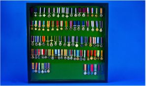 Military Interest Framed Wall Plaque Containing 86 Different Miniature Medals. All House In A