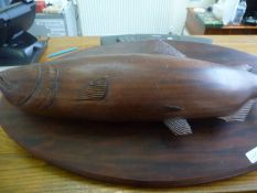 Large Solid Mahogany Carved Fish on an oval base, together with a cased set of fishing flies, (2).