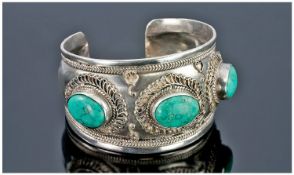 Broad Silver Bangle Set With Three Turquoise Coloured Stones  With Applied Wirework Decoration.