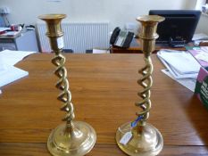 A Pair Of Large Candy Twist Brass Candlesticks on round bases. 12`` high.
