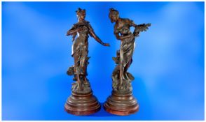 A Pair of French Spelter Figures of Maidens, one carrying flowers titled `Frisson De Mai` the other