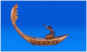 A Italian Carved Wooden Boat, with a woman paddling in the boat. Circa 1950`s. 12`` long.