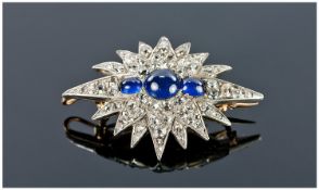 Very Fine Early 20th Century Gold Set Diamond and Sapphire Starburst Brooch, with Cabochon Cut