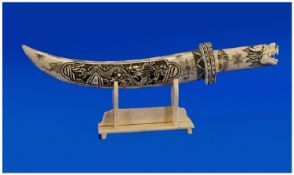 Carved Bone Style Dagger on Stand.