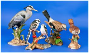 Collection of Four Various Bird Figures, comprising two from The Chancery Collection ``Common