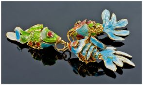 Three Silver Enamelled Articulated Fish Pendants.