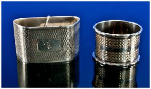 Two Silver Napkin Rings, both with engine turned decoration, one hallmarked for Birmingham 1936,