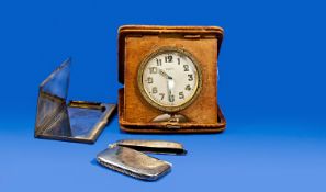 1930`s Leather Cased 8 Day Travelling Clock, Together With A Silver Vesta Case And A Chrome Card
