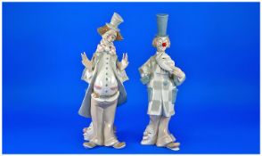 Lladro Style Spanish Pair Of Clown Figures. `The many faces of clowns`. One figure is damaged to
